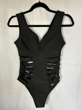 WOW COUTURE World of Women Black swim suit. Straps on sides. Size Small.